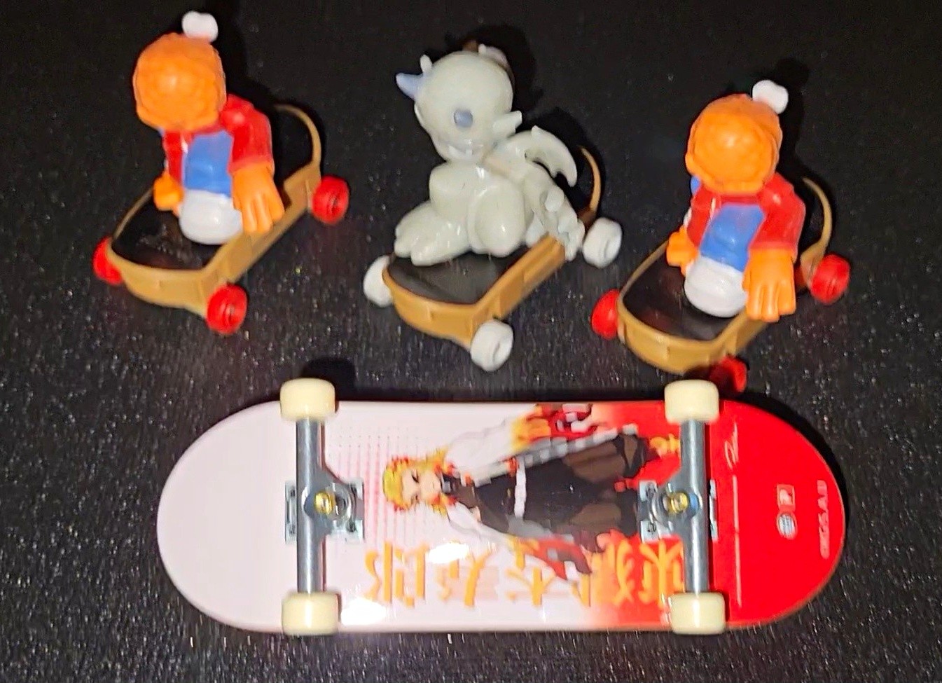 3 Tech Deck Free Rider Figures, and a tech deck