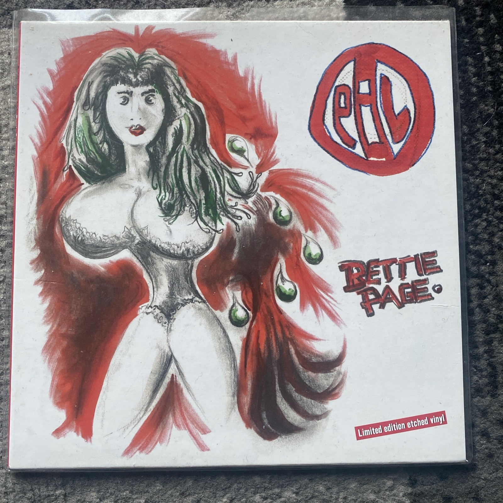 PUBLIC IMAGE .. BETTIE PAGE 7" LTD EDITION ETCHED . NEW & SEALED 
