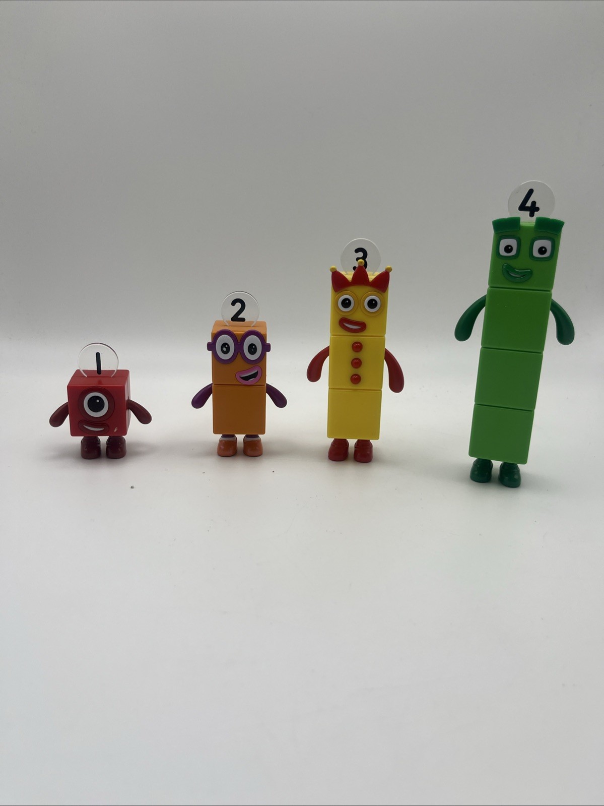 Blocchi numerici 1-4 giocattoli action figure BBC cartone animato lotto di 4 pezzi blocchi volti