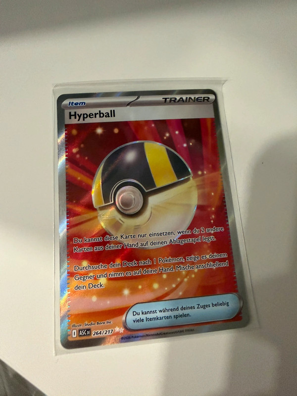 Pokémon Hyperball Gold Secret Rare 264/217 – Karmesin & Purpur