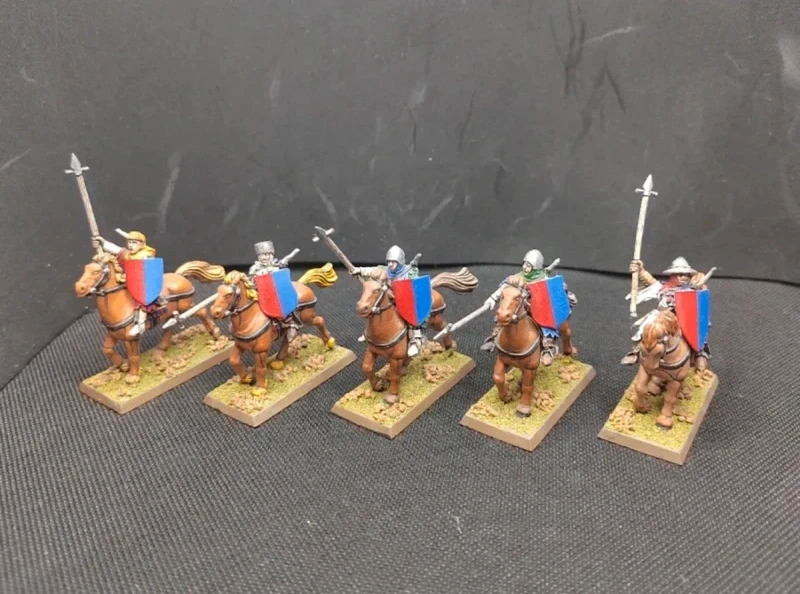 Hombres de armas a caballo.