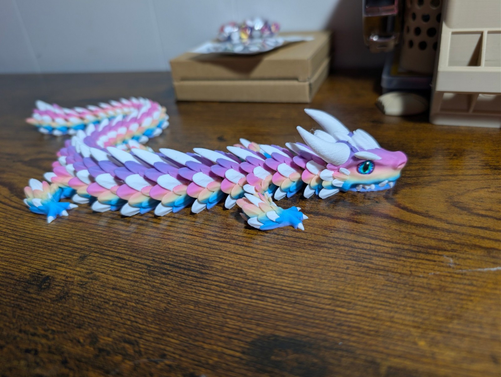 3D Printed Zephyros Articulated Dragon - Lollipop Rainbow with Blue Glass Eyes -