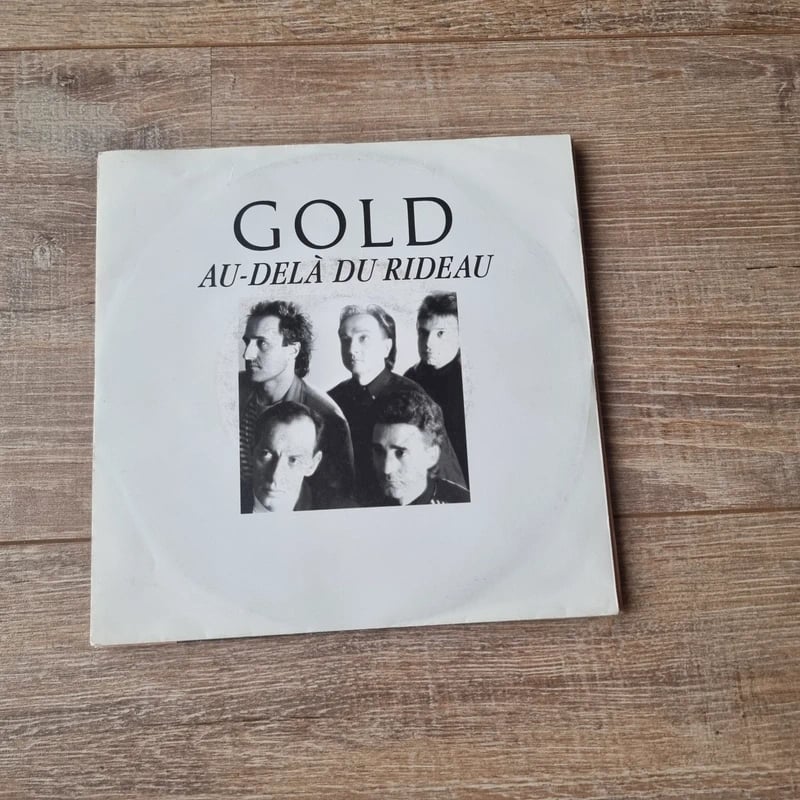 7" Gold – Au-Delà Du Rideau