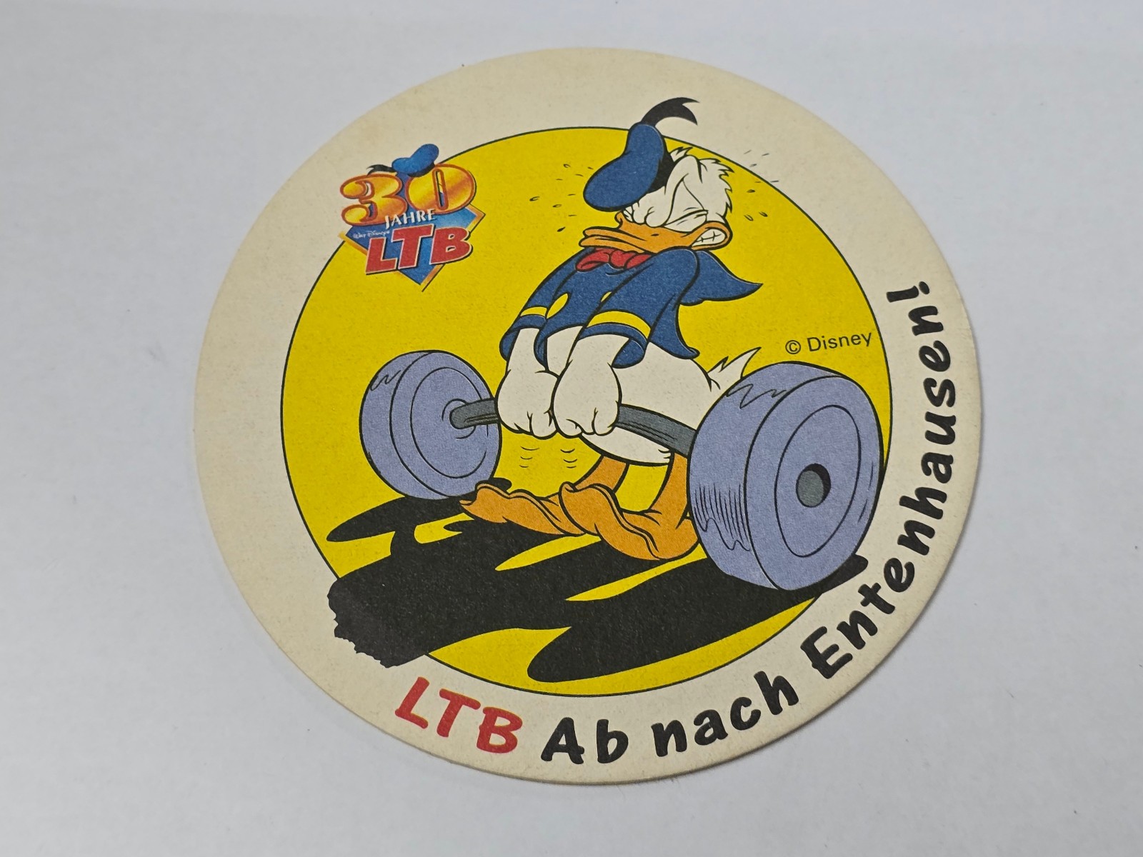 Sottobicchiere birra Disney Paperino LTB 30 anni 1997 sollevamento pesi da collezione 