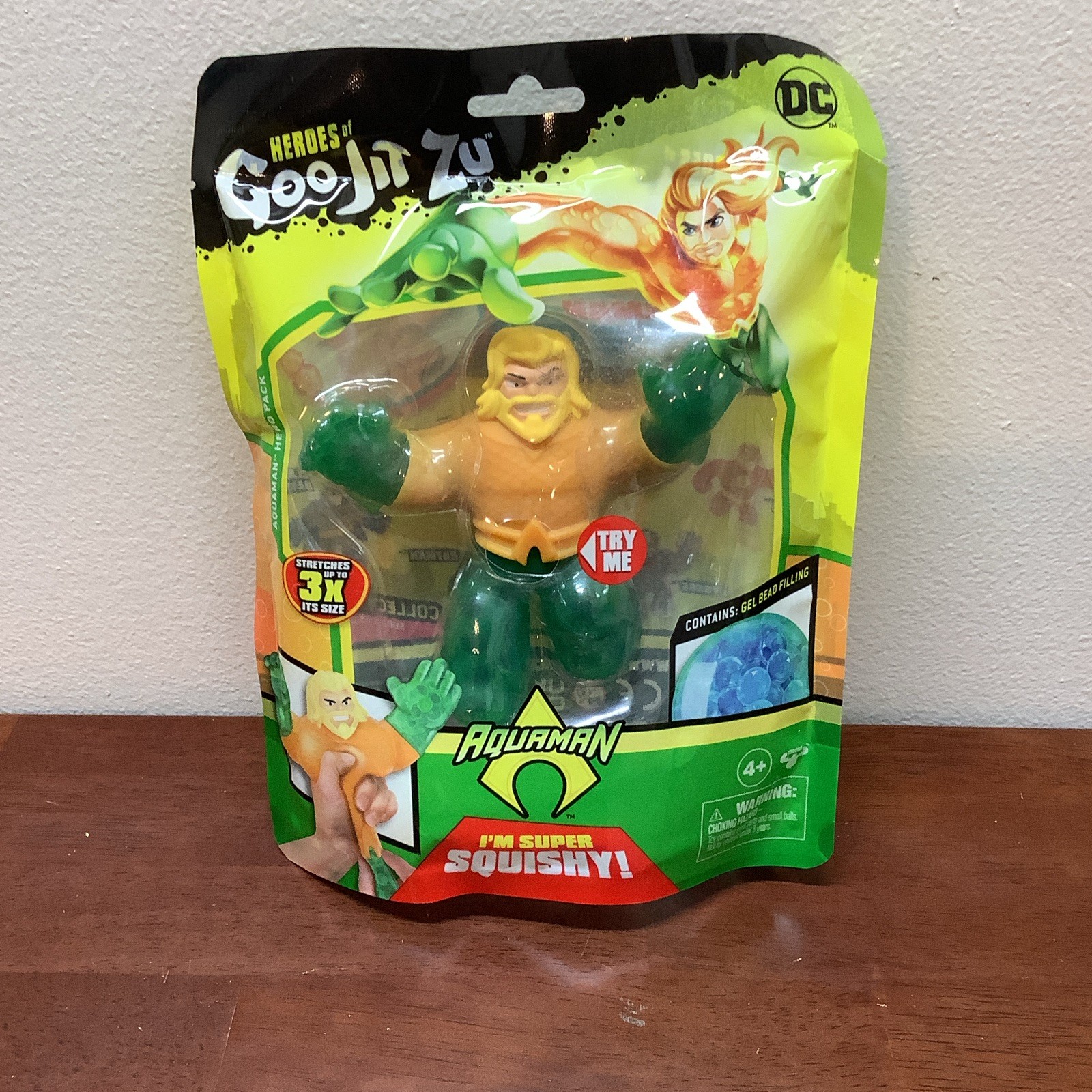 DC Heroes of Goo Jit Zu Aquaman Stretchy Squishy Gel Figura di Perline NUOVO