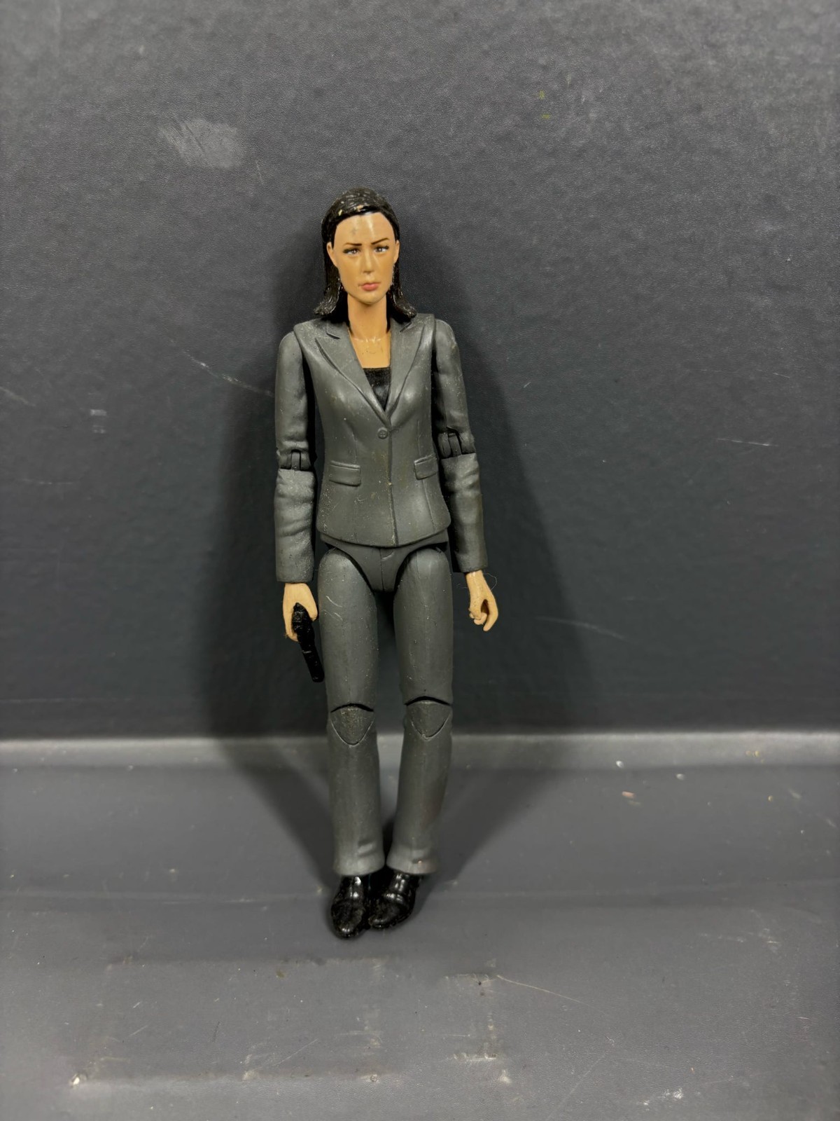 Action Figure Woman in Gray Suit Toy Collectible