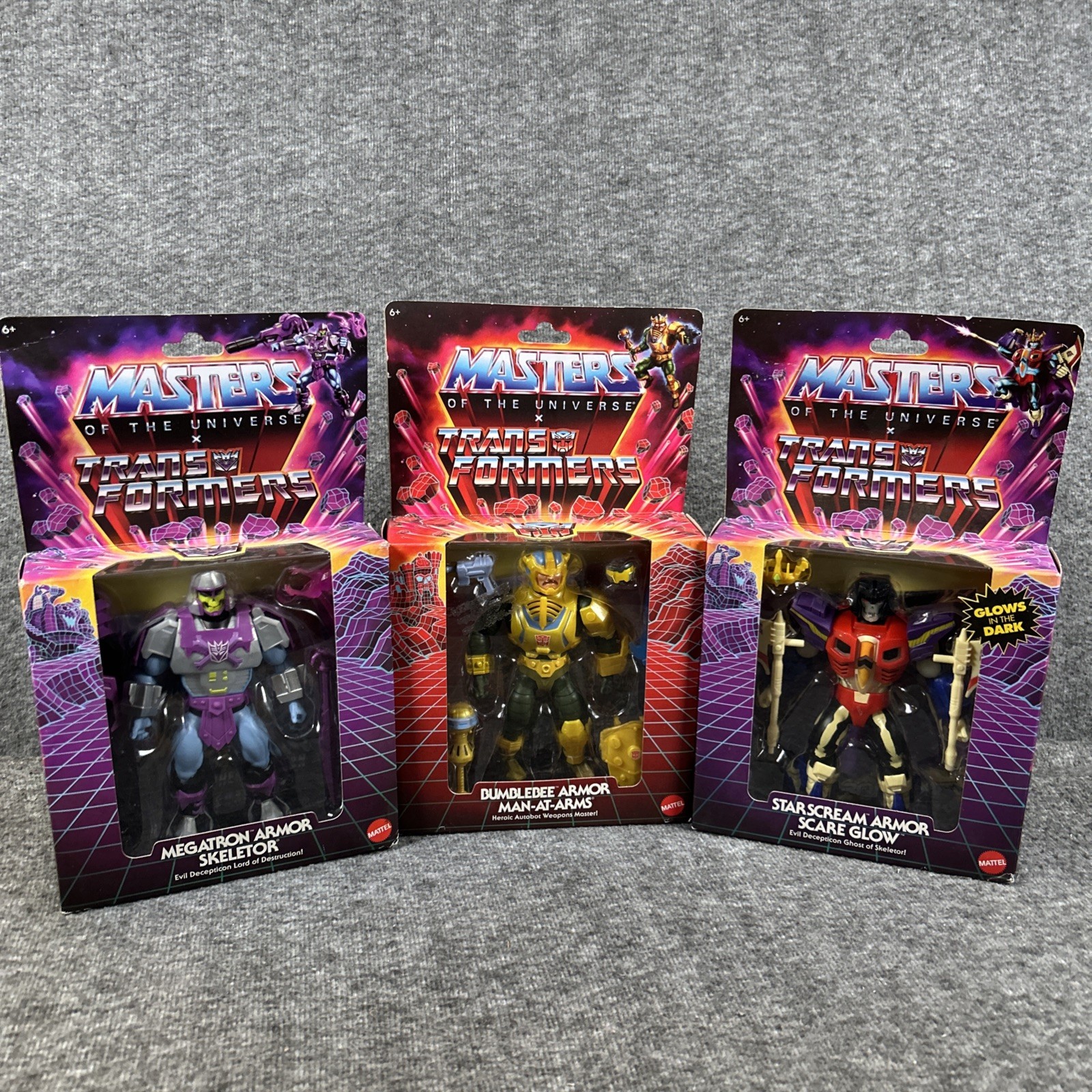 Pacchetto 3 figure MOTU x Transformers Starscream Bumblebee Megatron nuovo con scatola sigillato