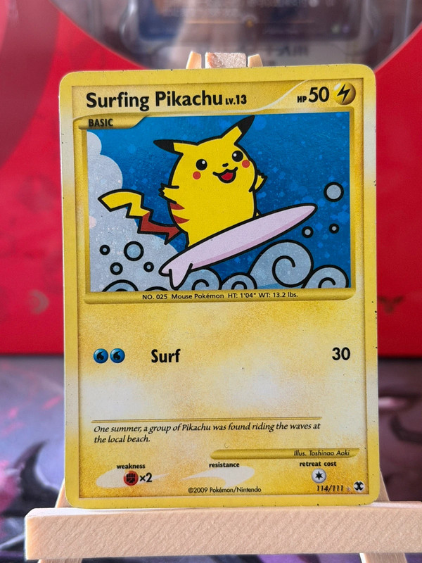 2009 Pokémon Rising Rivals Surfing Pikachu Lv.13 Holo Swirl 114/111