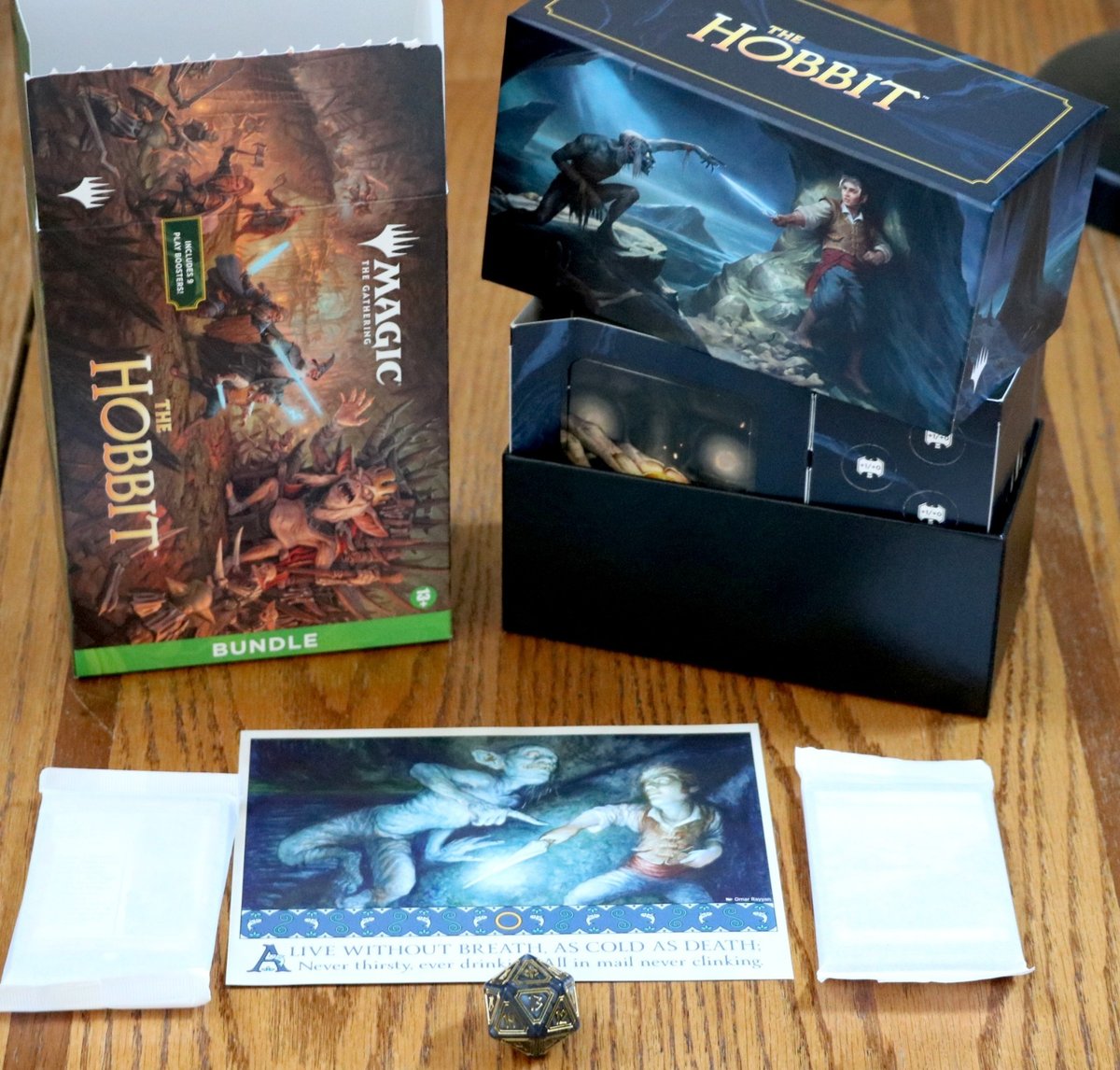 MTG Lo Hobbit Bundle Card Box + Spindown oversize D20 + pacchetti carte promozionali