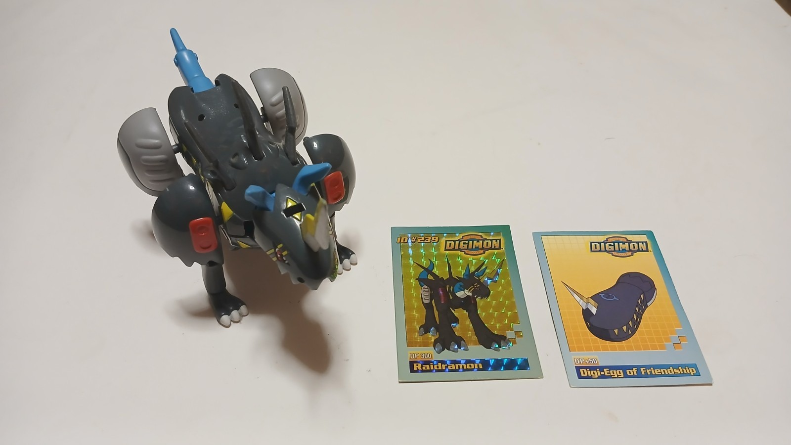 Digimon Digivolving Raidramon/Digiegg con 2 carte