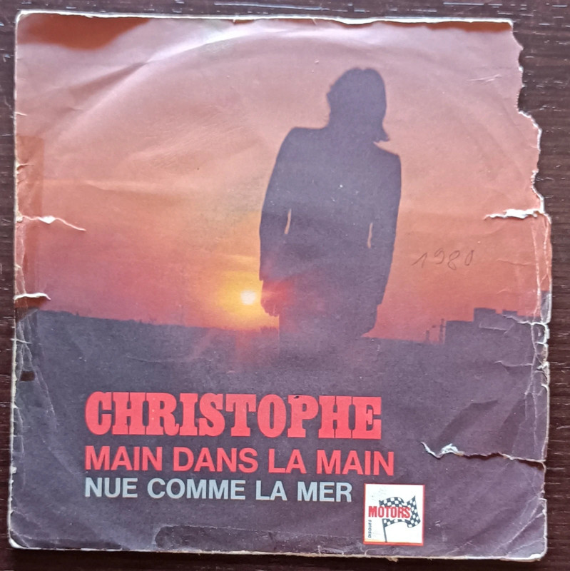 Christophe Main dans la main