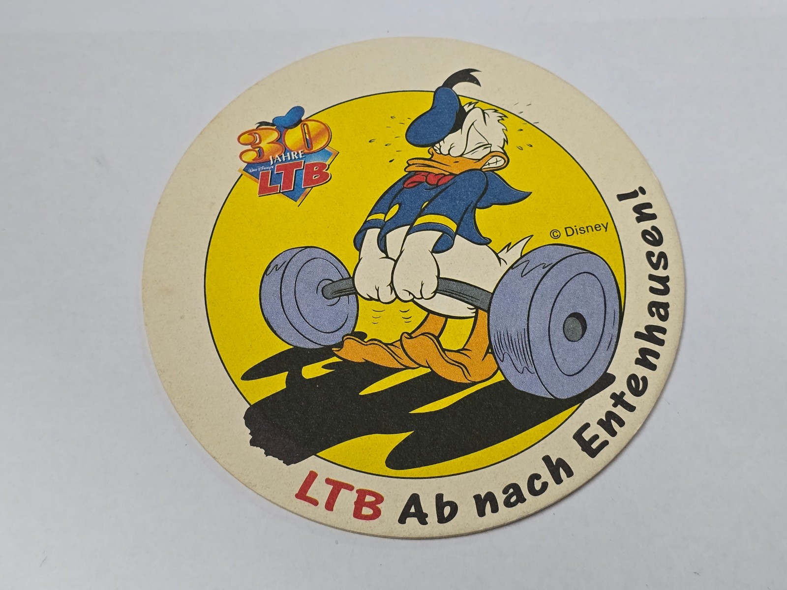 Sottobicchiere birra Disney Paperino LTB 30 anni 1997 sollevamento pesi da collezione