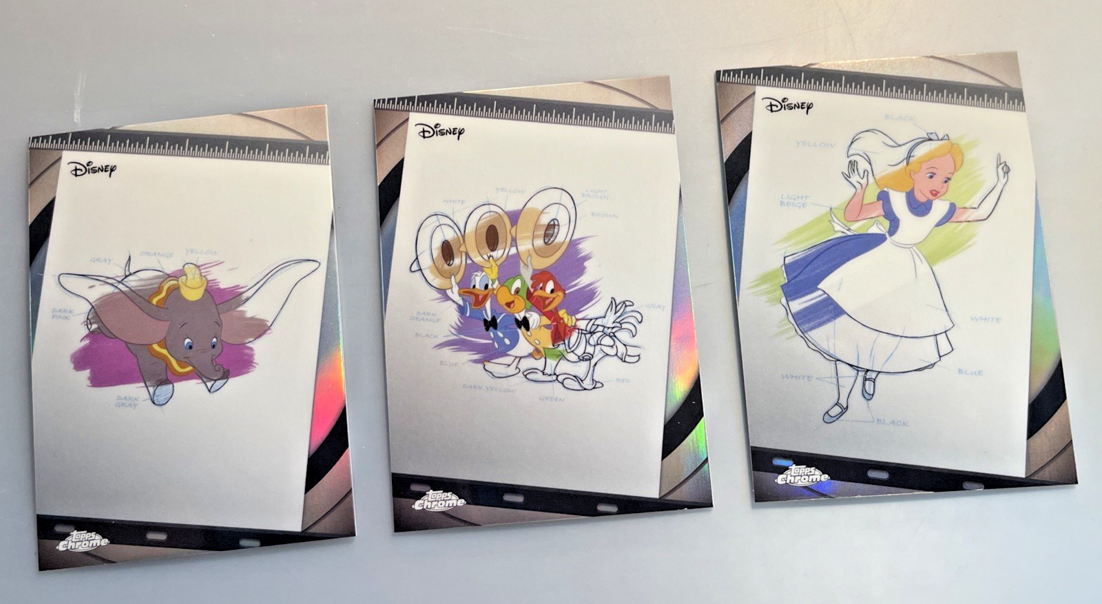 Lotto 3 INCHIOSTRO e PITTURA Topps Chrome Disney 2026 DUMBO I 3 CABALLEROS e ALICE