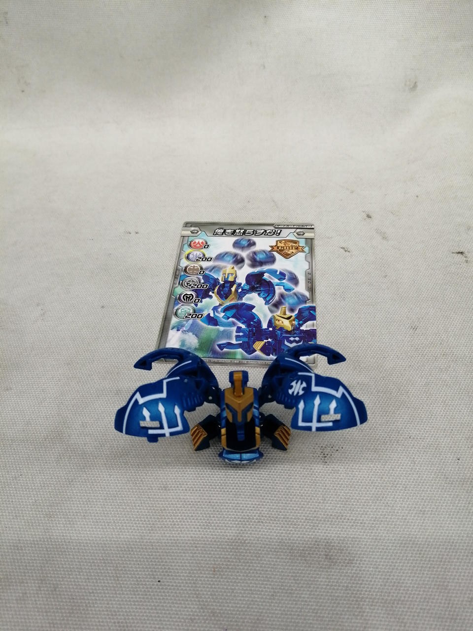 SEGA TOYS Bakugan Gun Ikarasu Blue Transforming Ball Figure with Ability Card