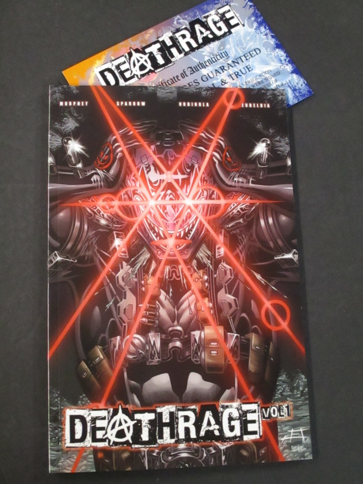 FIRMATO SHAWN HUDACHKO SOFT BACK DEATHRAGE VOLUME #1 SHIKARII ART MERC TPB AV2