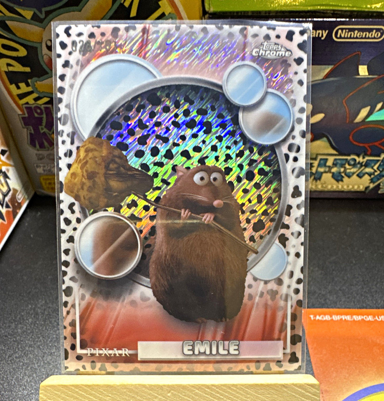 Topps 2026 Topps Chrome Pixar Ratatouille Emile #49 numerato di serie 028/101