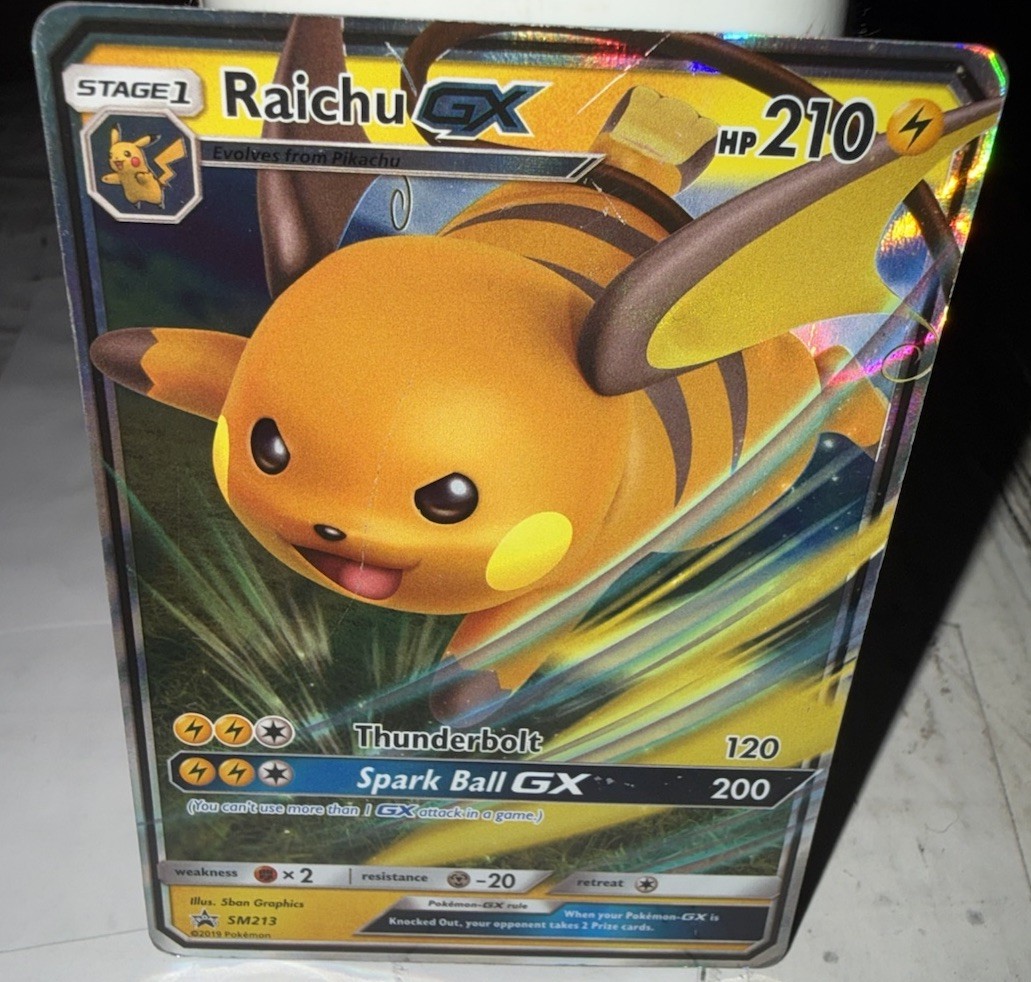 Carta Holo Promo Pokémon TCG Raichu GX Stella Nera SM213
