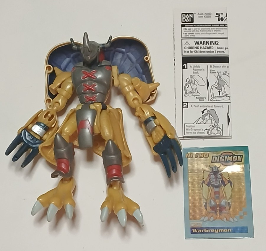 Digimon Digivolving WarGreymon/Agumon con scheda e istruzioni