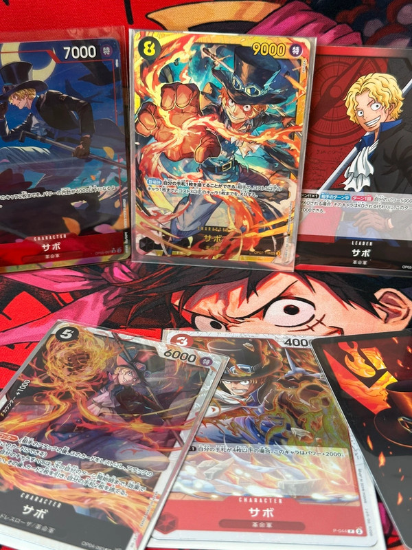 Lot Sabo 9 cartes – Alt Art OP05-007 + SEC OP07-118 + SR + Promos + DON – Sleeves offertes