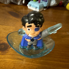 Disney cartoon character figurine blue cape clear blue base gray arm cannon