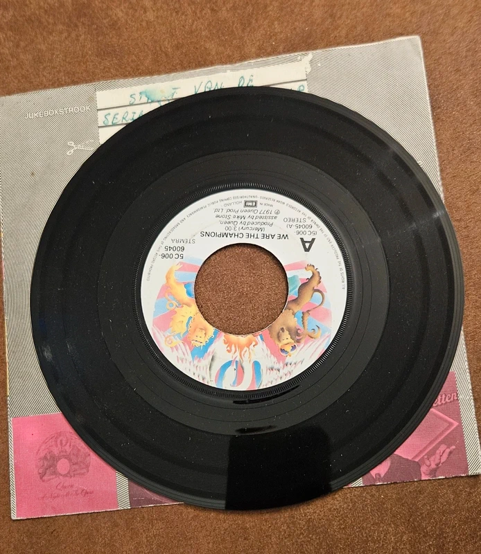 Vinyl single queen we are the champions/we will Rock you