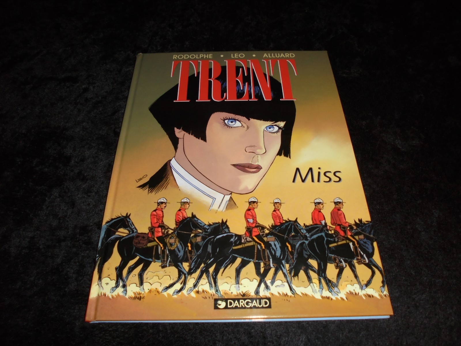 Rodolphe / Léo / Alluard : Trent 7 :  Miss EO Dargaud 1999