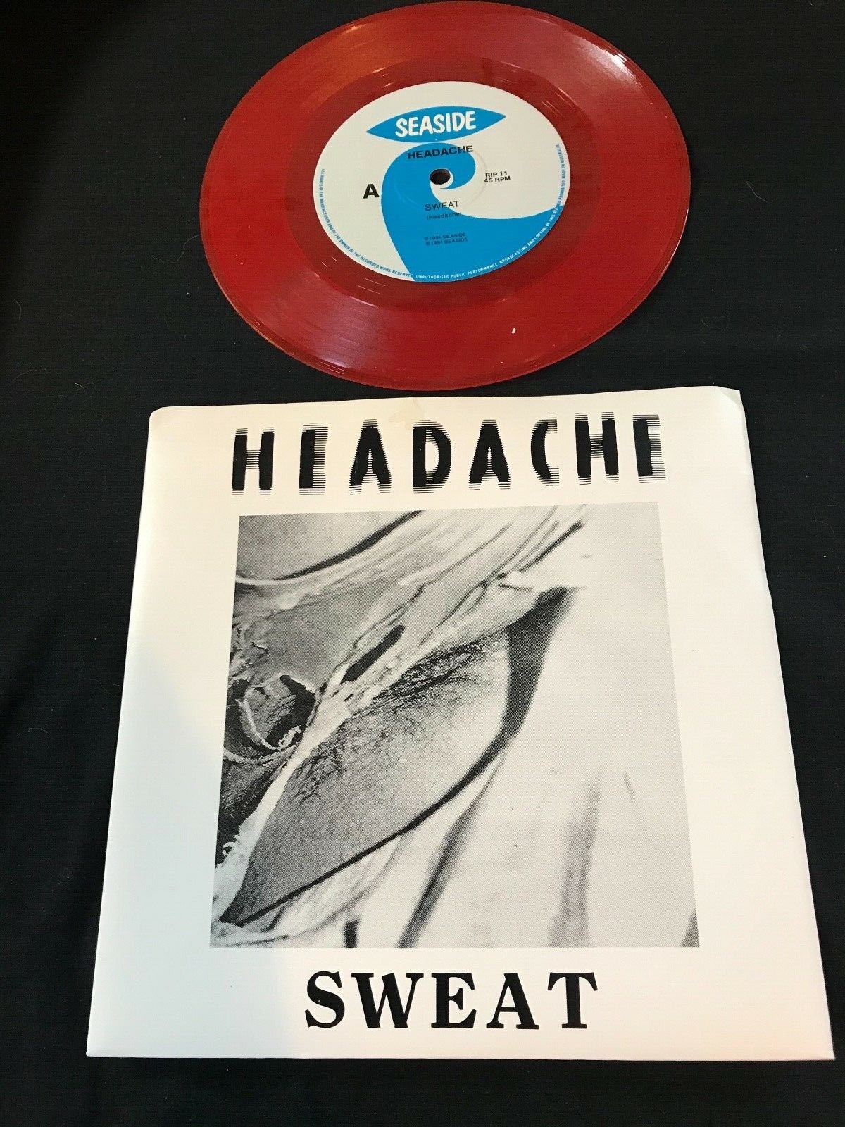 Headache 7" Color Single RIP 11 Sweat/Clear As Mud