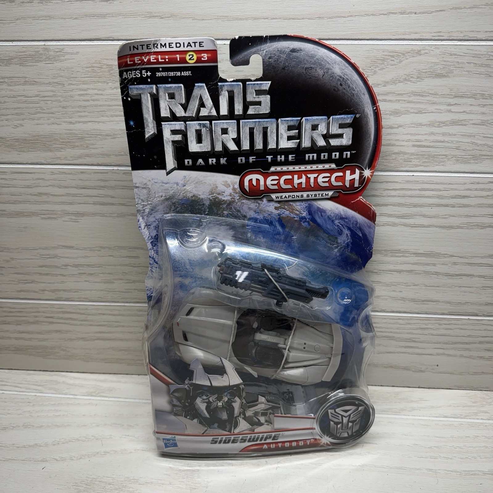 Transformers DOTM Deluxe Sideswipe Autobot nuovo in confezione ammaccato a bolle