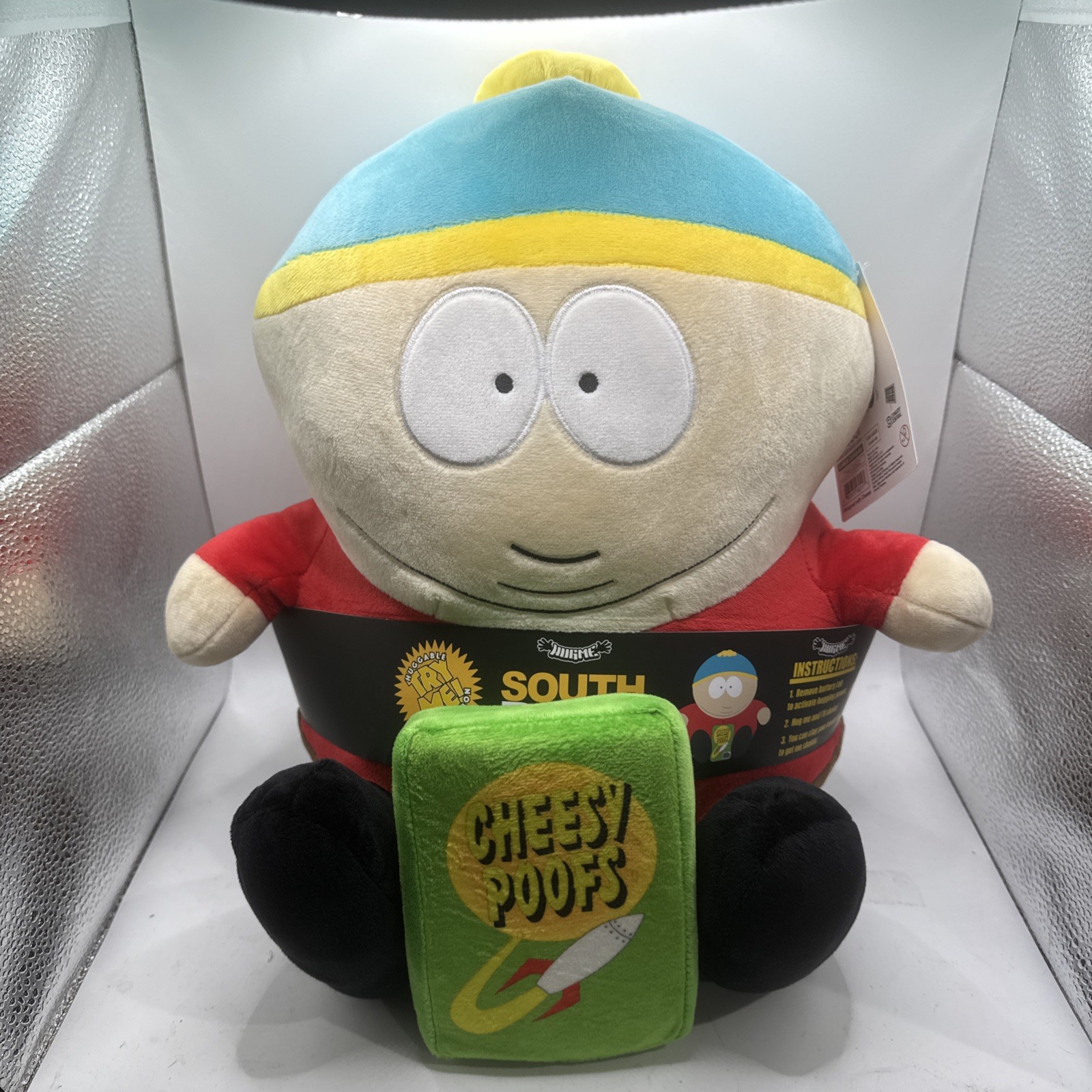 South Park - Peluche vibrante Cartman con Cheesy Poofs HugMe 16"