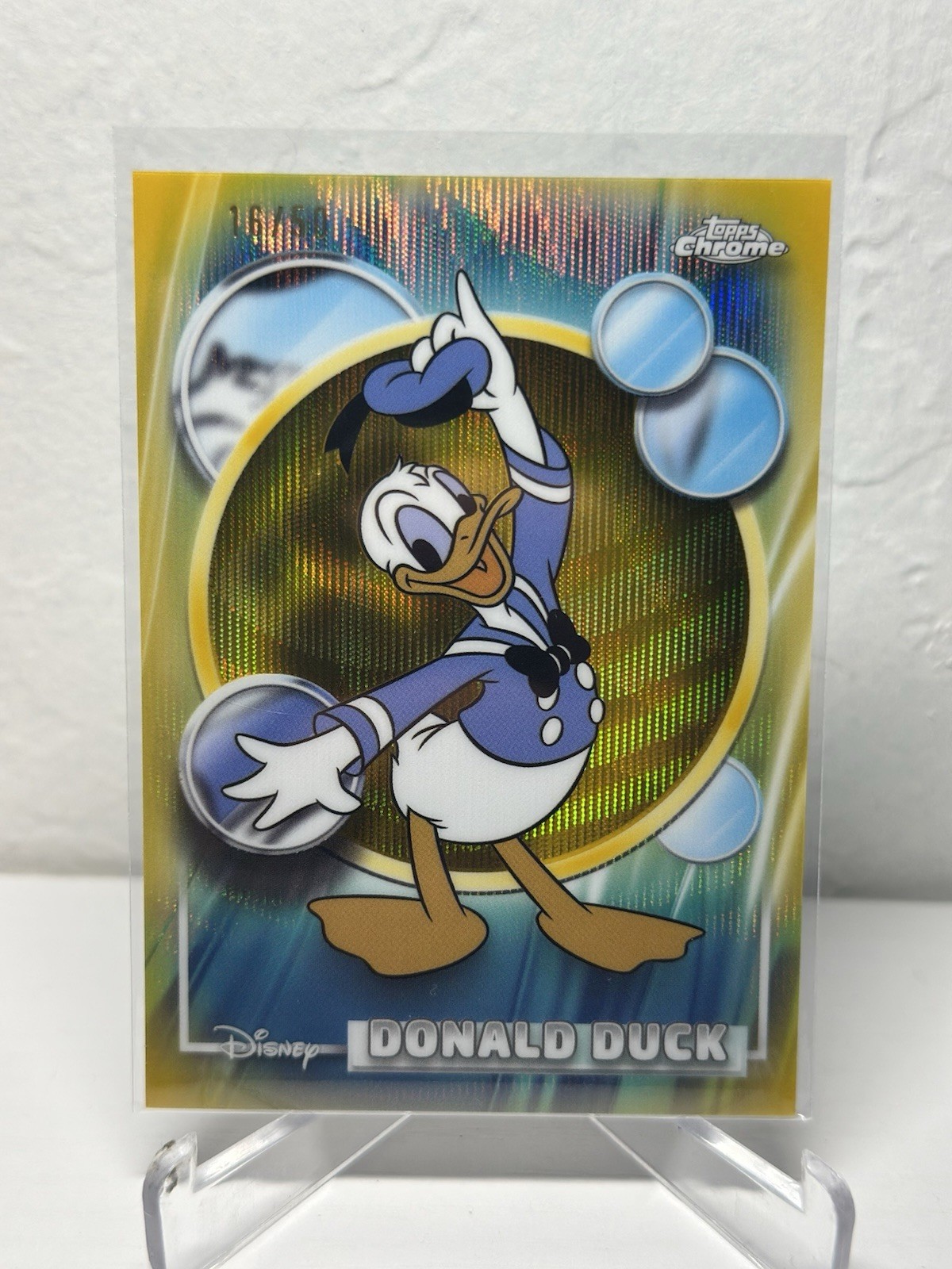 2026 Topps Chrome Disney Paperino rifrattore onda oro /50 #99 SP RARO