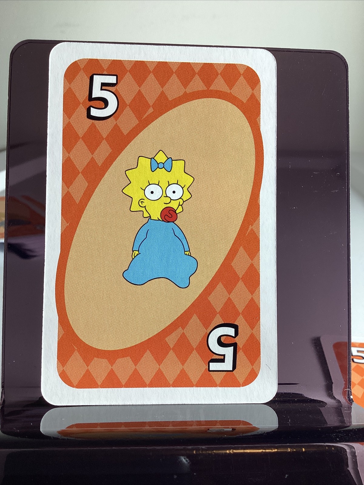 2025 UNO Simpsons Maggie #5 carta arancione
