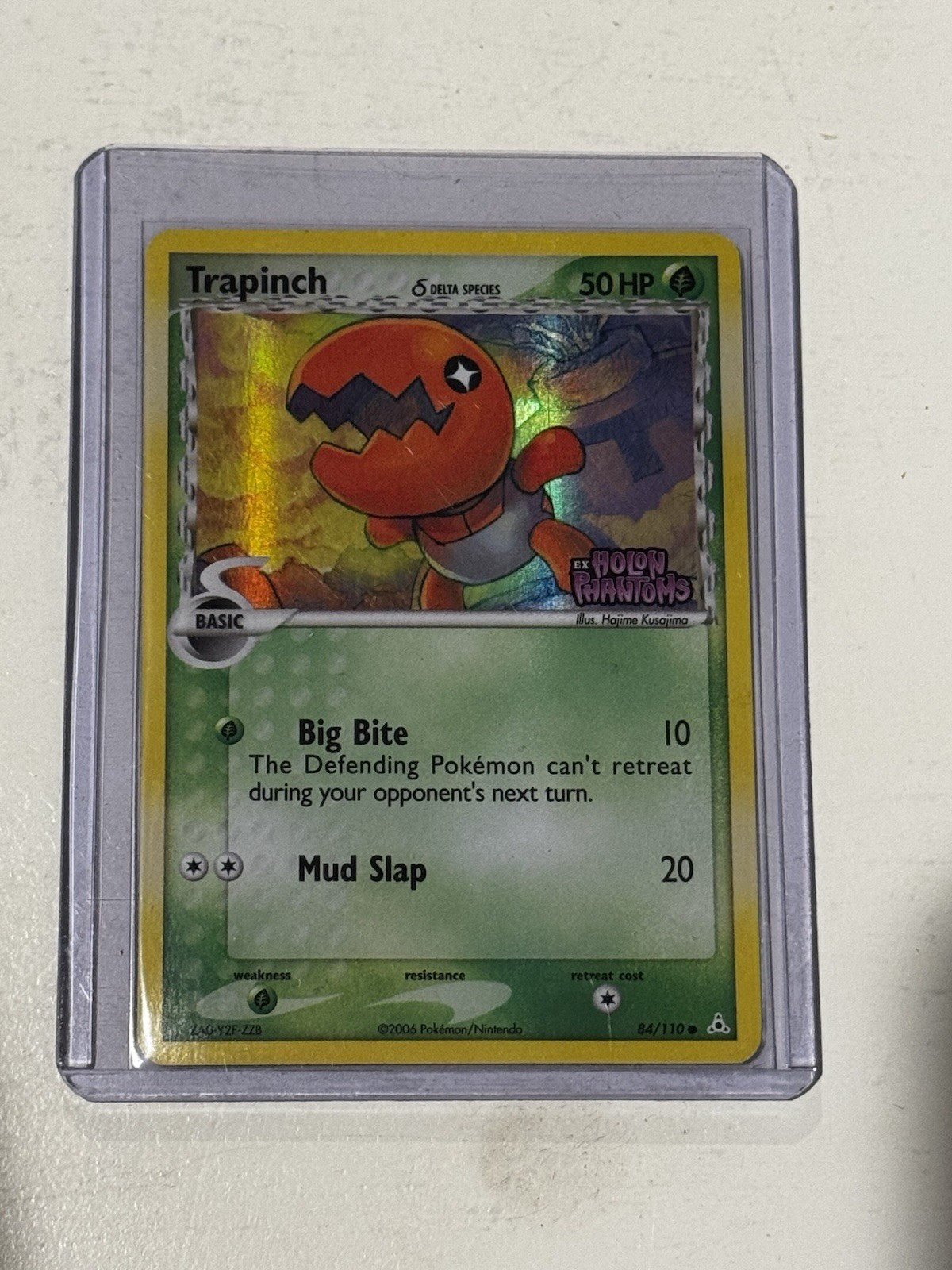 Trapinch #84/110 EX: Holon Phantoms Holo timbrato - leggermente giocato
