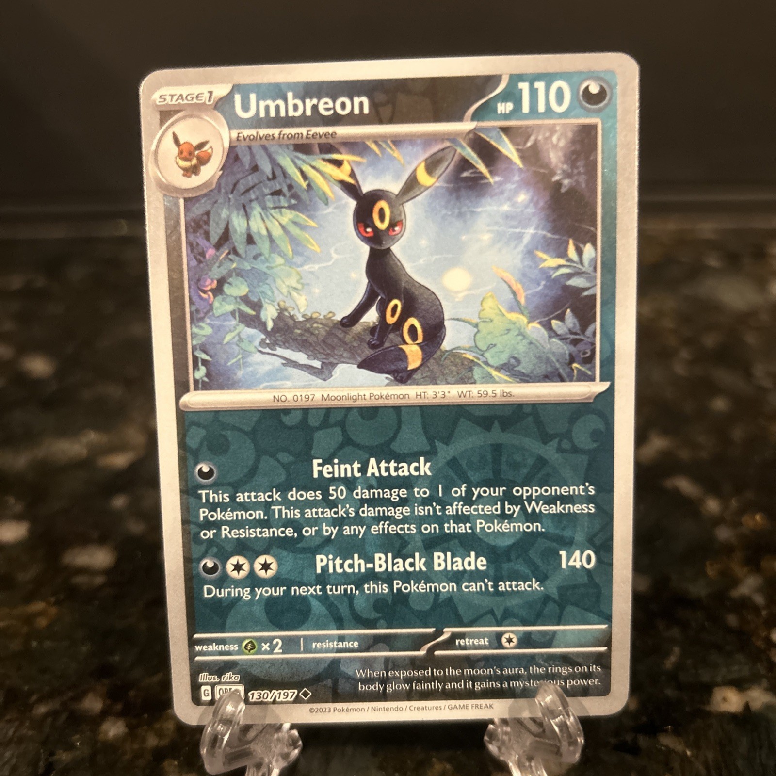 Umbreon 130/197 SV03: Obsidian Flames Reverse Holo