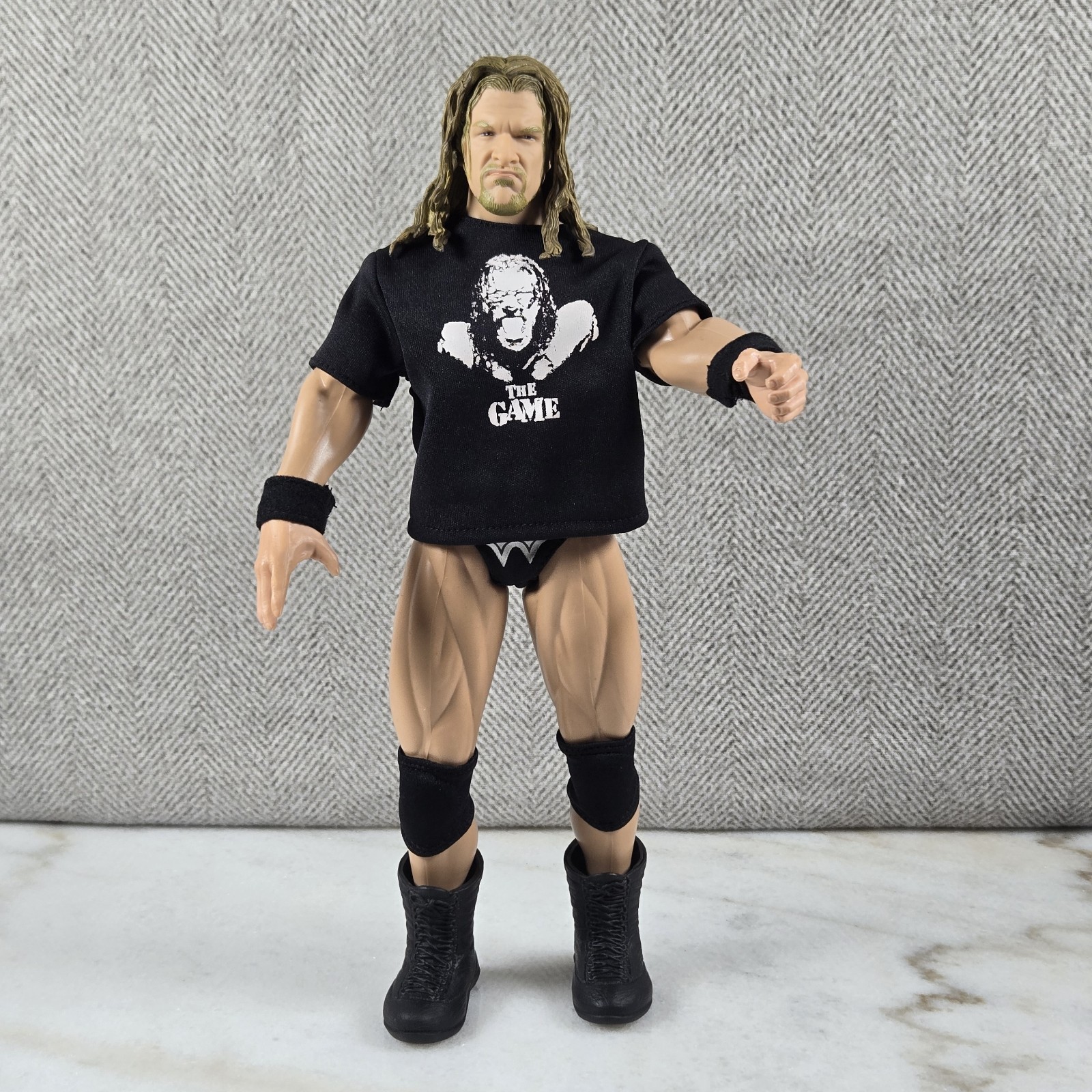 Camicia WWE Triple H "The Game" capelli lunghi e viso iconico logo Jakks Aggression