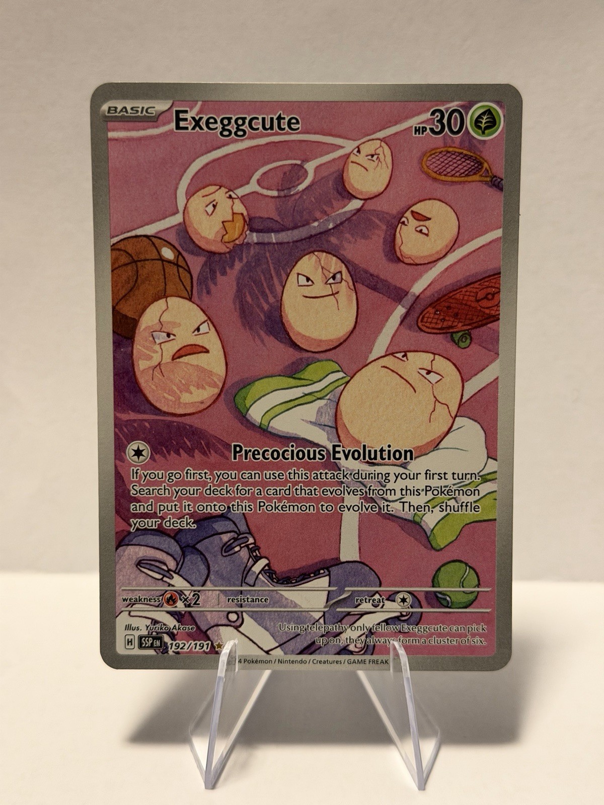 Pokemon TCG Exeggcute 192/191 Sv08: Surging Sparks Holo quasi nuovo