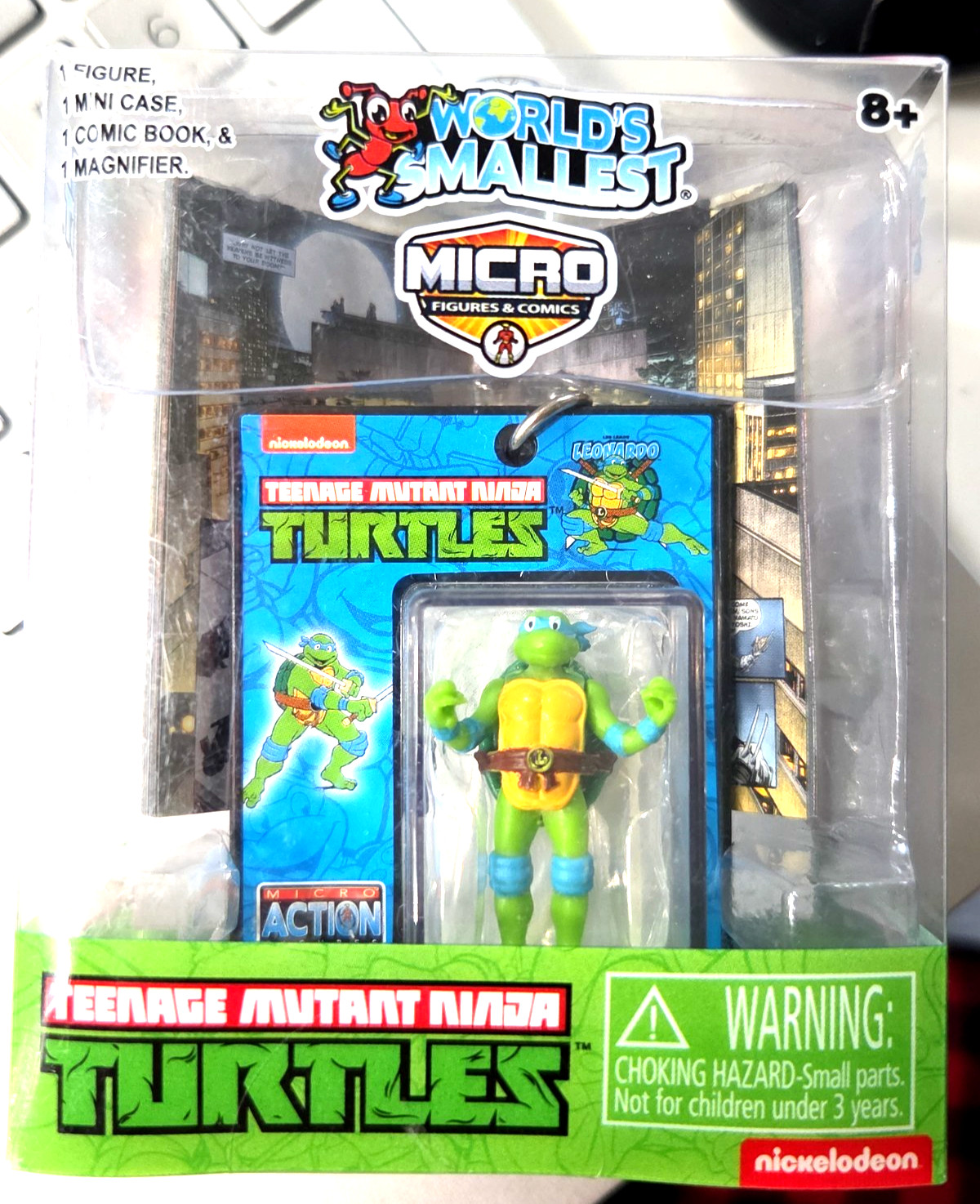 Tartaruga Ninja Mutante Micro Teenage più piccola del mondo con custodia lente di ingrandimento fumetto NUOVO