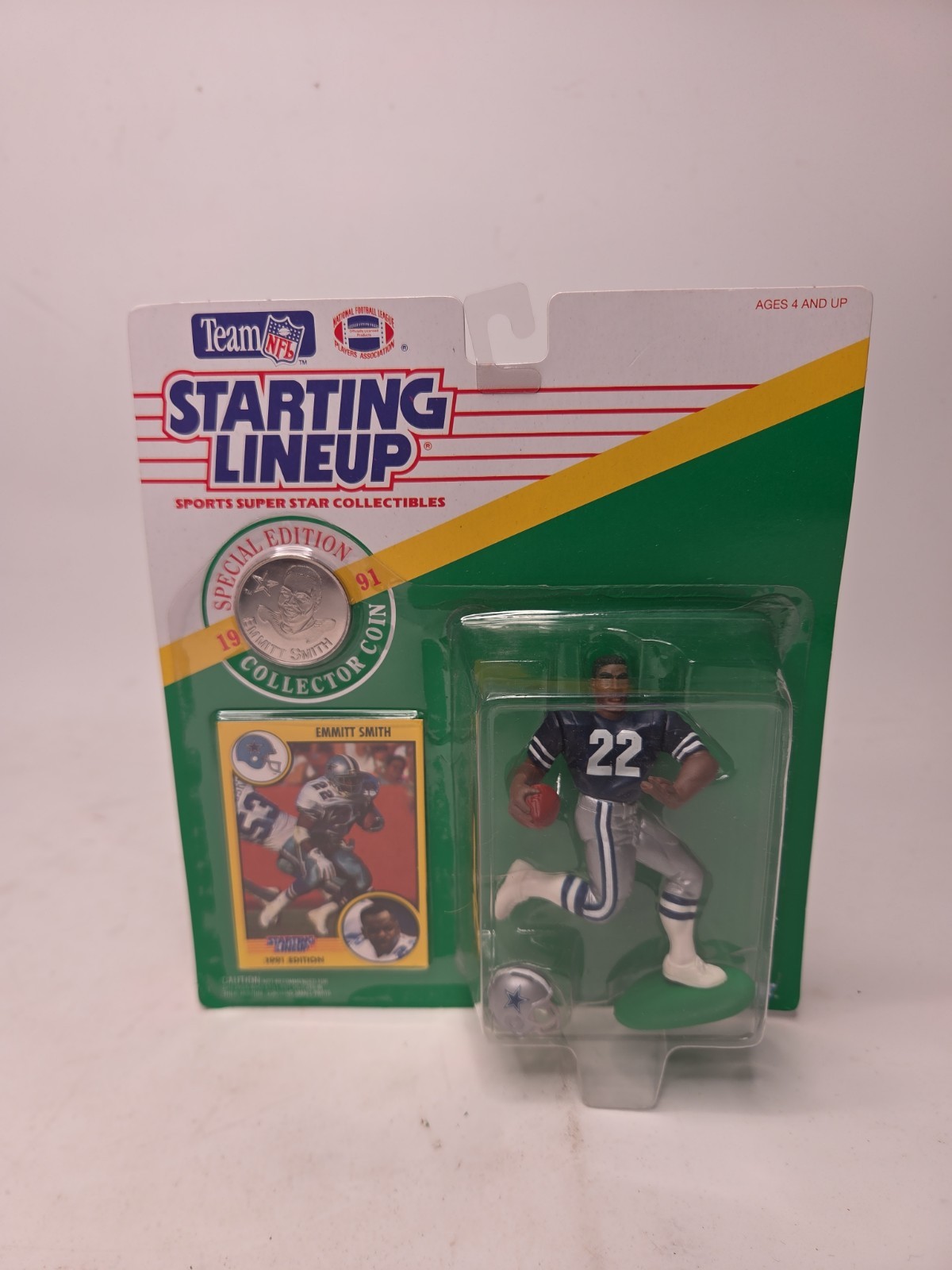 Figurina Emmett Smith 1991, formazione iniziale con moneta e carta da collezione