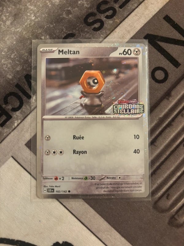 Carte Pokémon Meltan 102/142 Holo Tampon Couronne Stellaire – FR