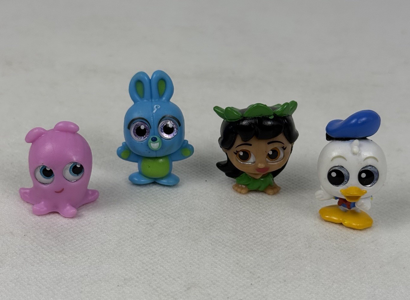 4 minifigure Disney Doorables & Just Play Paperino coniglietto Lilo polpo