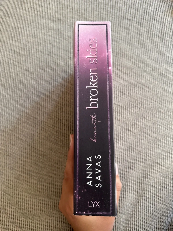 Anna Savas beneath broken skies