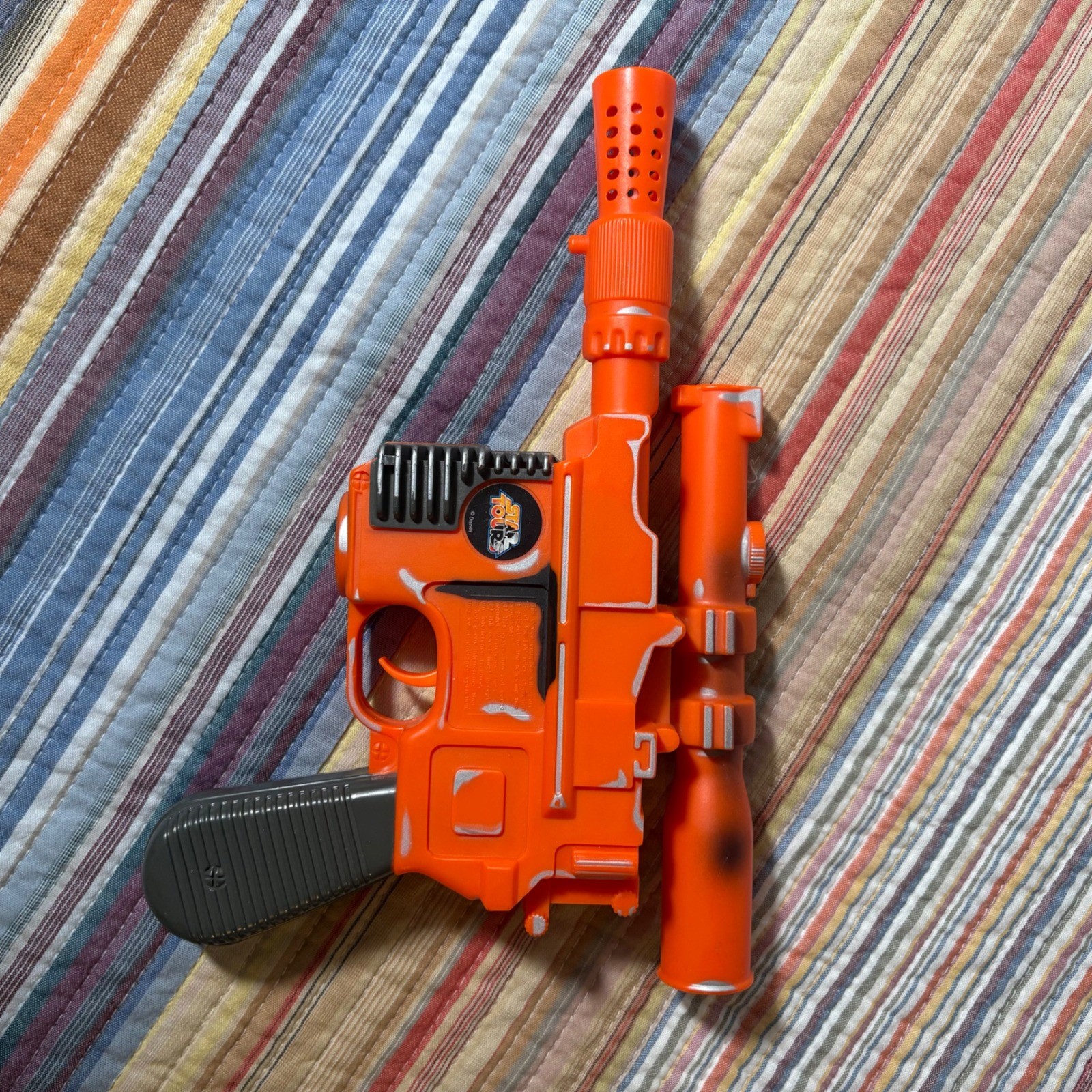 Disney Star Tours Star Wars Han Solo DL-44 Blaster giocattolo arancione argento usurato