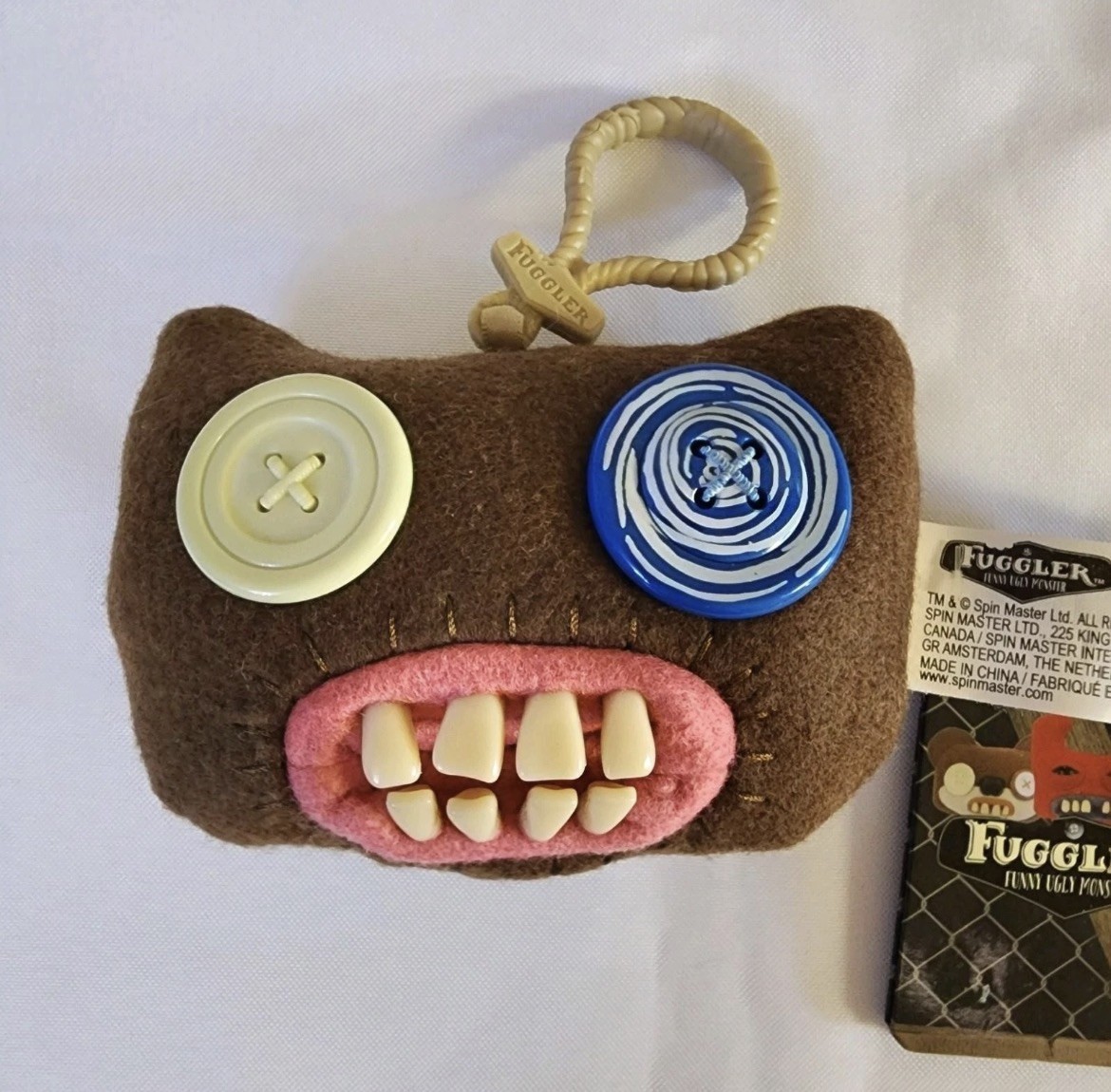 Portachiavi Fuggler Spinmaster originale da collezione Mr. Buttons marrone nuovo con etichetta