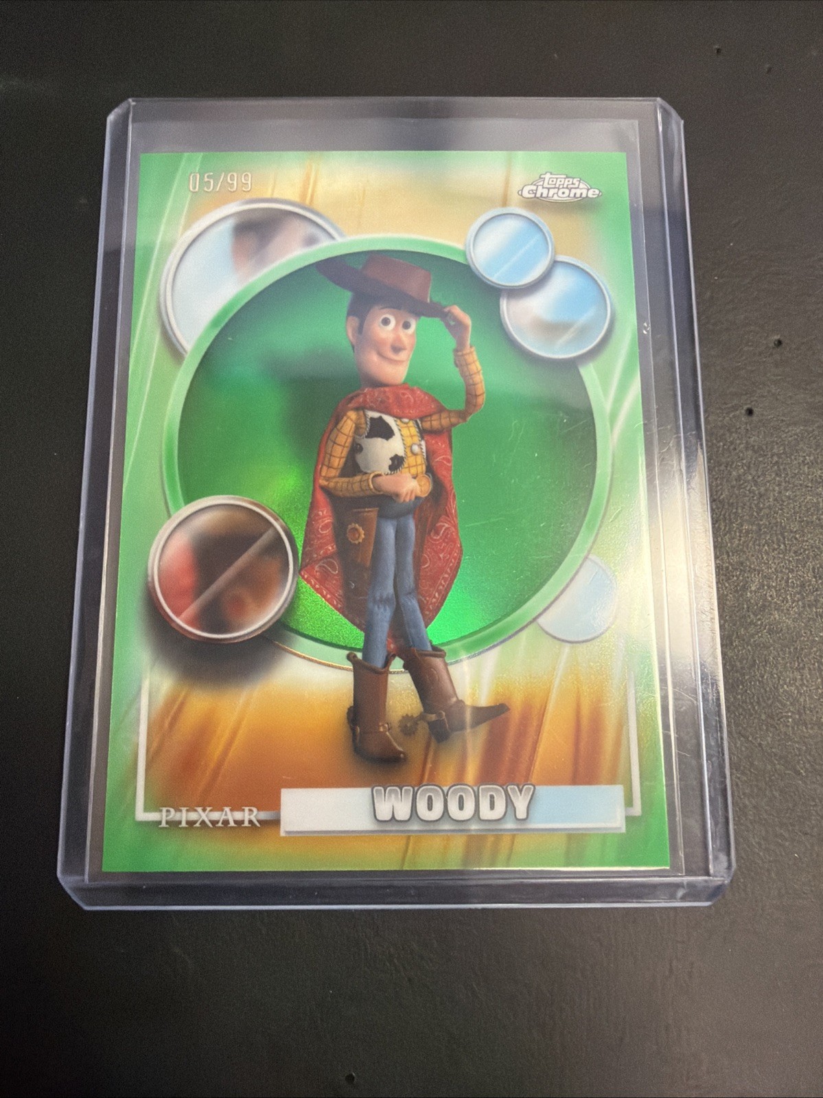 2026 Topps Chrome Disney Woody Green Refractor #/99 Toy Story 5