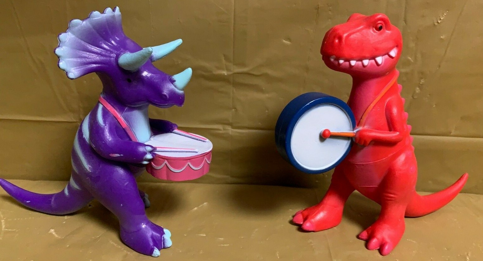 Marching Dino Duo - Tyrannosaurus and Triceratops -Red & Purple