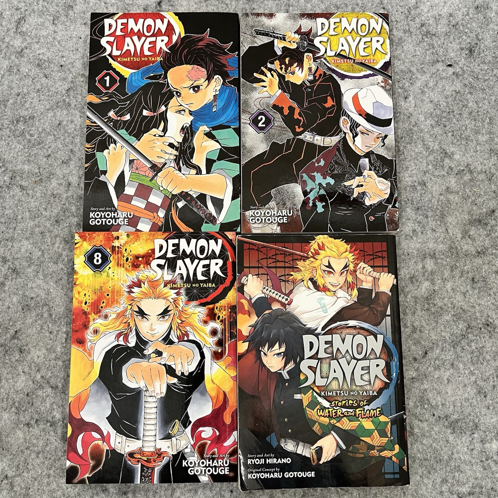 Lotto 4 libri Demon Slayer manga vol 1 2 8 storie fiamma acqua VIZ Shonen Jump