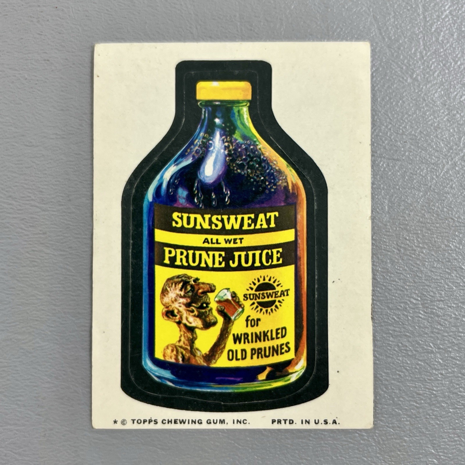 Topps 1974 Wacky Packages adesivo inutilizzato succo di prugna sudore solare USA