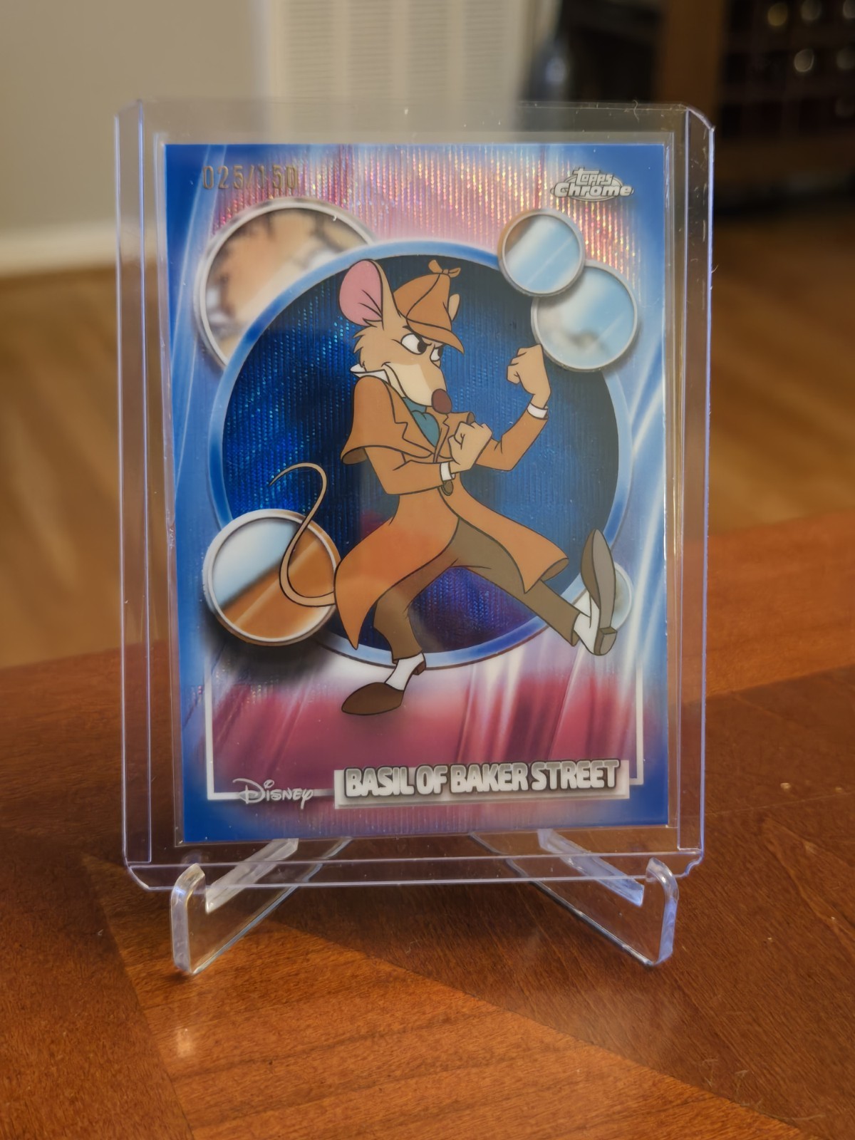 2026 Topps Disney Cromo Basilio di Baker Street Rifrattore Onda Blu 025/150